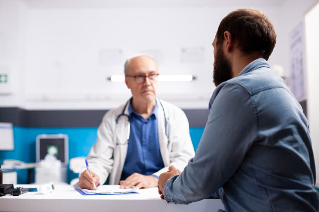 Men's Health Clinics in Dubai - A man consults with a doctor 