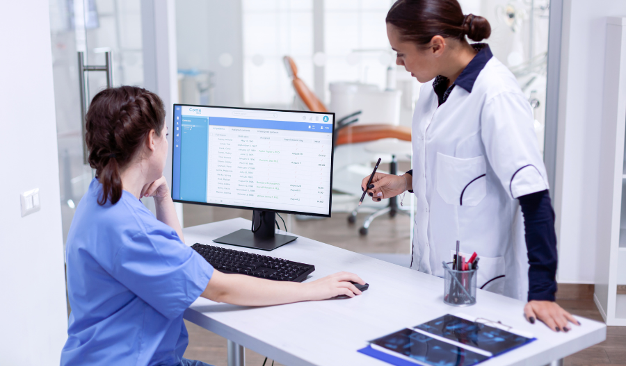 Healthcare CRM Solution - Two female medical staff using laptop