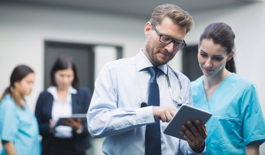 Allergy Specialists in Dubai [Doctor and nurse looking through their tablet]